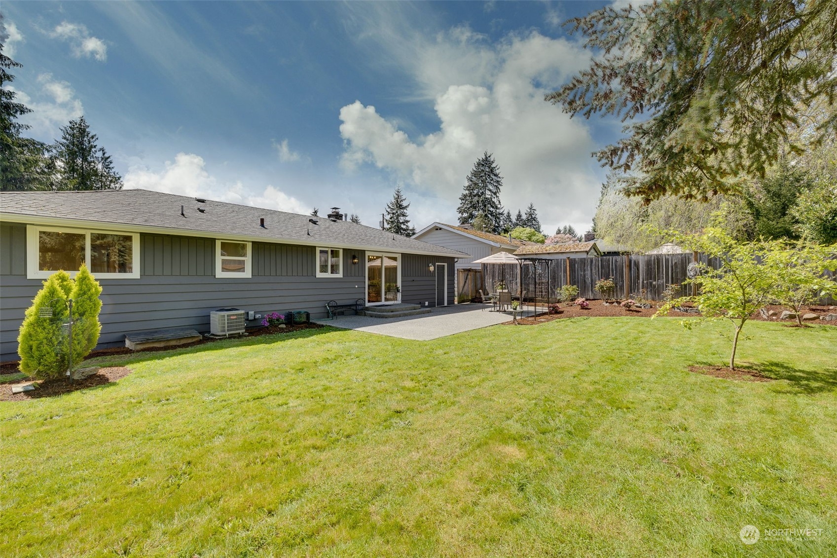 103 234th Street Southwest Bothell, WA 98021 - Photo 28 of 30 a front view of a house with a garden and plants