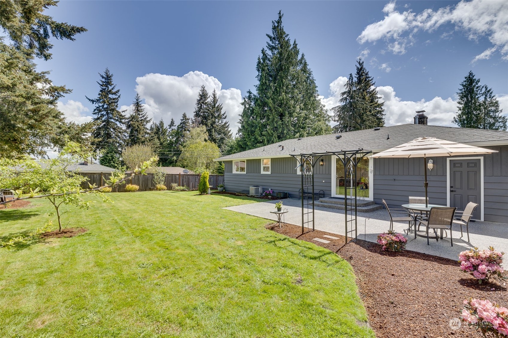 103 234th Street Southwest Bothell, WA 98021 - Photo 29 of 30 a front view of a house with a yard and seating space