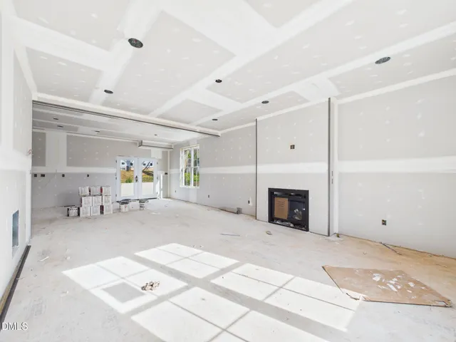 a view of livingroom with furniture and a fireplace