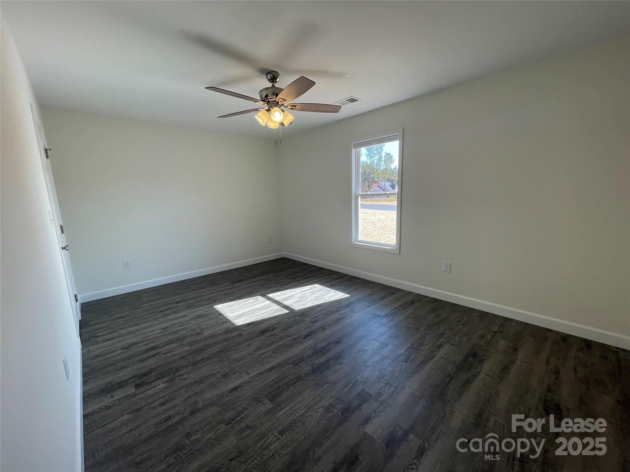 4020 Eugene Drive Lincolnton, NC 28092 - Photo 5 of 13 a view of empty room with wooden floor and window