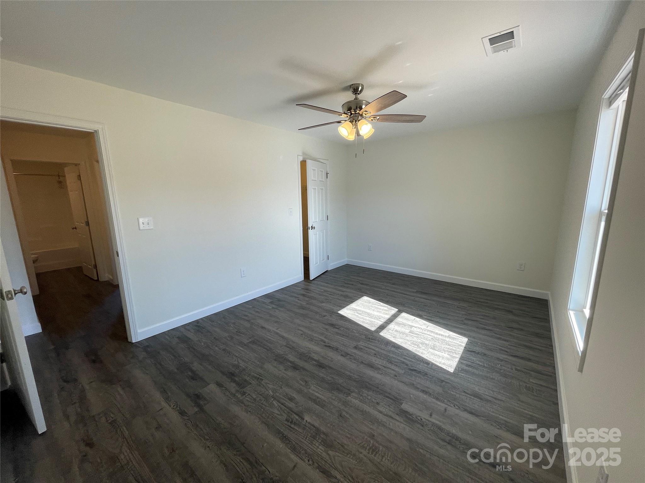 4020 Eugene Drive Lincolnton, NC 28092 - Photo 6 of 13 wooden floor in an empty room with a window