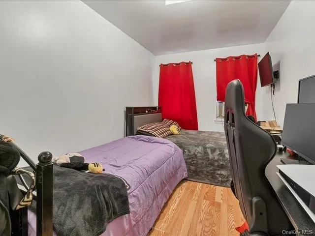 a bed room with a bed and a chair