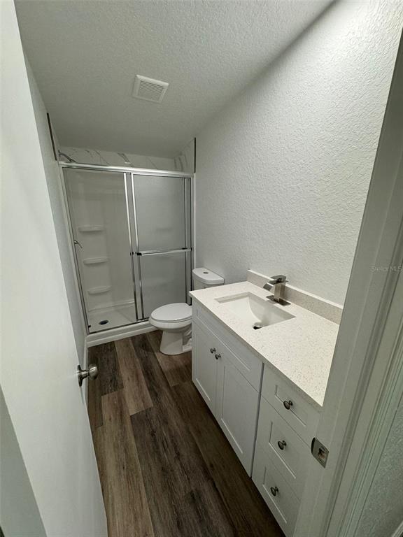 4970 Harrison Road Mims, FL 32754 - Photo 19 of 30 a bathroom with a sink a mirror and shower