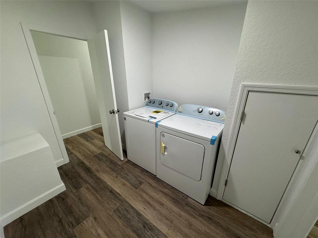 4970 Harrison Road Mims, FL 32754 - Photo 23 of 30 a utility room with dryer and washer