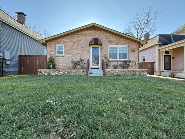 a front view of house with yard and yard