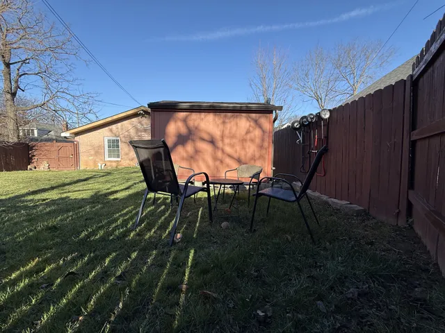 a view of yard with outdoor seating