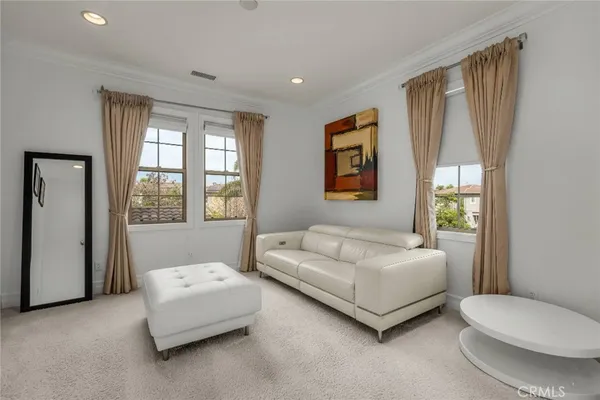 a bathroom with a granite countertop double vanity sink a mirror and a bathtub