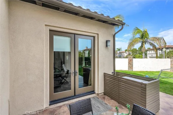 a front view of a house with a garden and plants