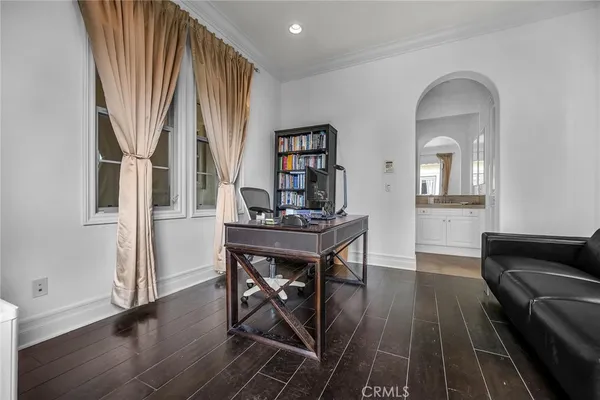 a kitchen with granite countertop a table and chairs in it