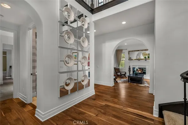 a view of staircase with railing and a window