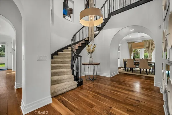 a living room with fireplace furniture and a large window