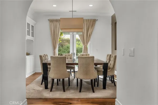 a living room with fireplace furniture and a large window