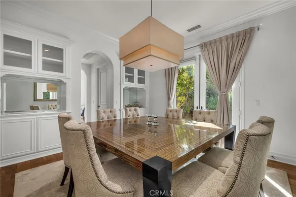 a kitchen with stainless steel appliances kitchen island granite countertop a stove a sink and a refrigerator