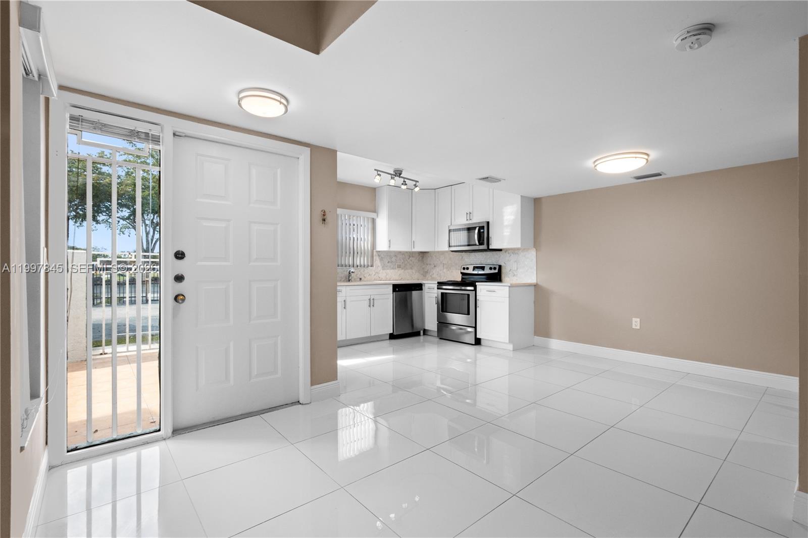 6211 Southwest 138th Court, Unit B Miami, FL 33183 - Photo 6 of 27 a view of a kitchen with electric appliances