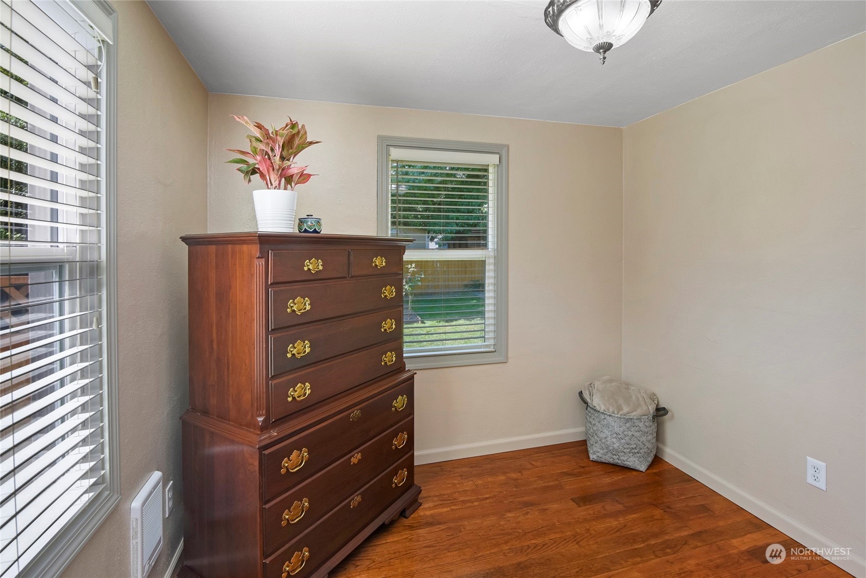 3609 Southeast 5th Place Renton, WA 98058 - Photo 11 of 40 a room with a dresser and a window