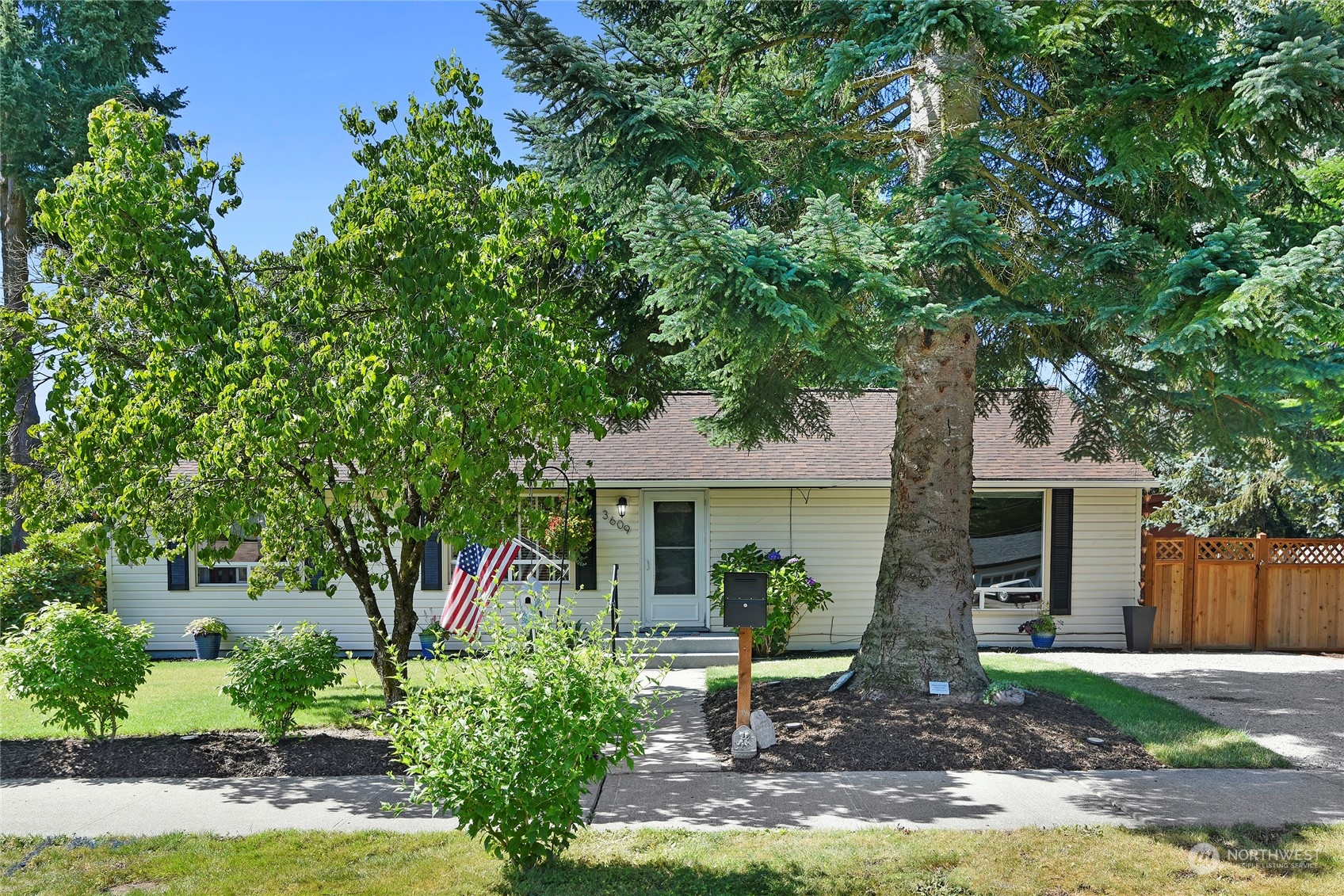 3609 Southeast 5th Place Renton, WA 98058 - Photo 2 of 40 a front view of a house with garden