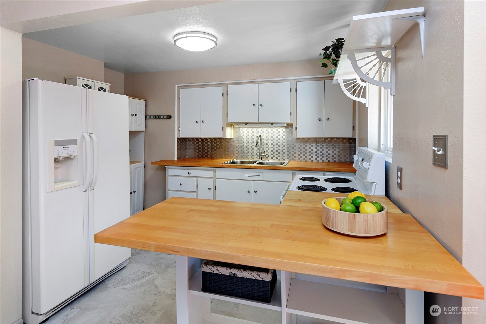 3609 Southeast 5th Place Renton, WA 98058 - Photo 23 of 40 a kitchen with stainless steel appliances granite countertop a sink a refrigerator and a stove