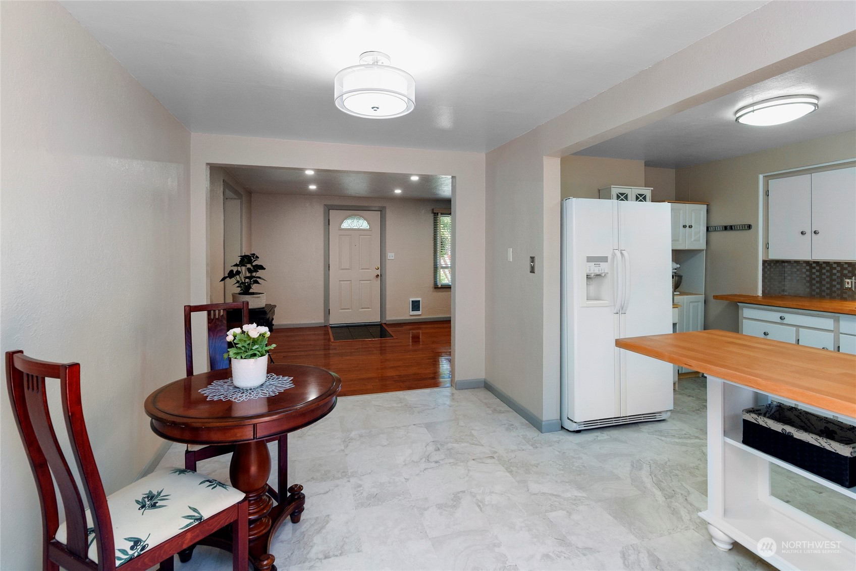 3609 Southeast 5th Place Renton, WA 98058 - Photo 26 of 40 a kitchen with stainless steel appliances a table and chairs in it