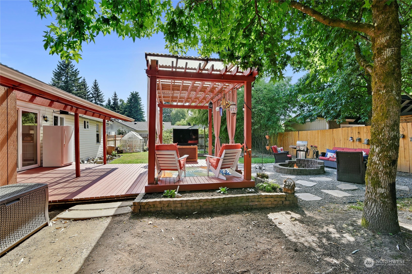 3609 Southeast 5th Place Renton, WA 98058 - Photo 27 of 40 a view of a house with backyard sitting area and garden