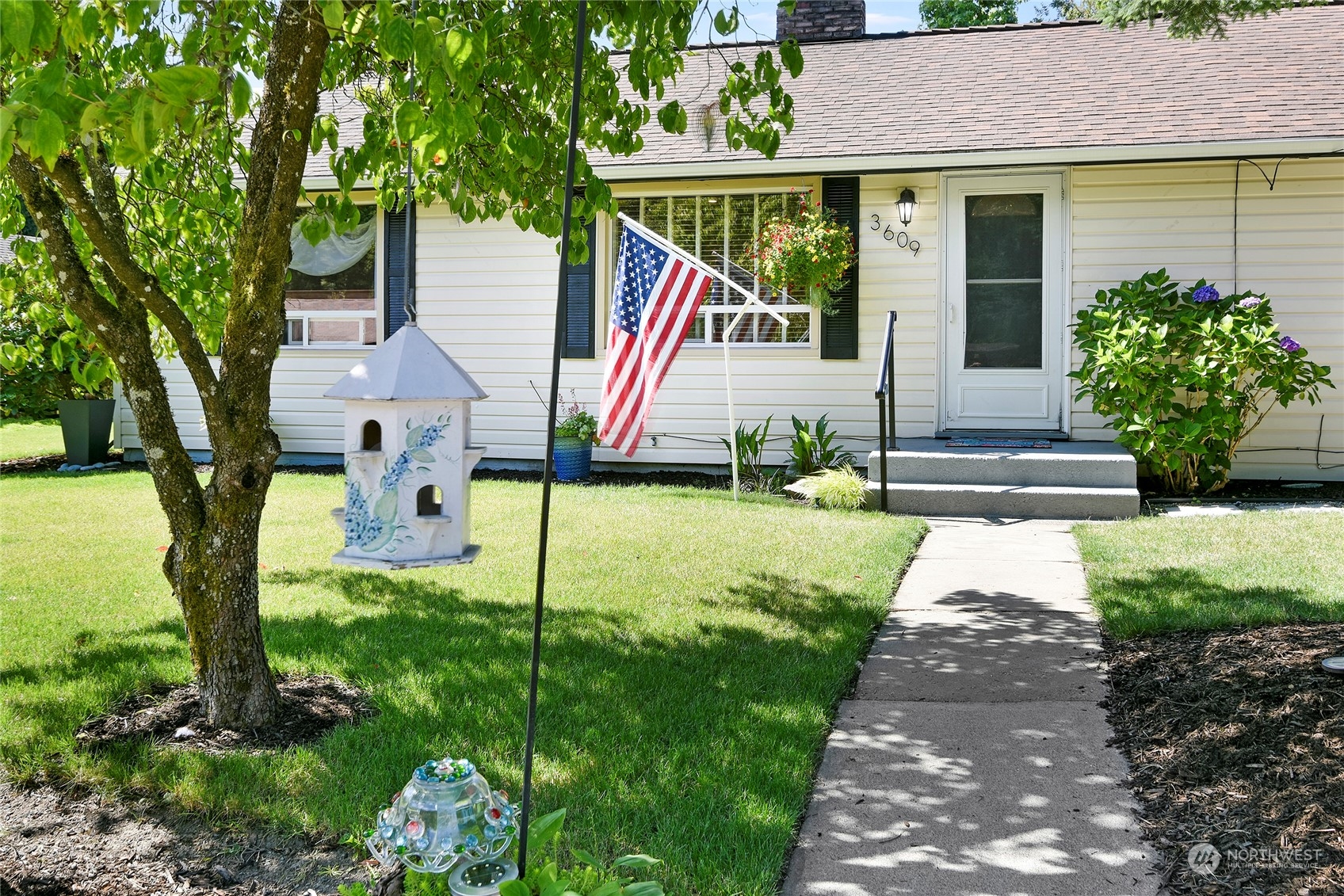 3609 Southeast 5th Place Renton, WA 98058 - Photo 3 of 40 a front view of a house with garden