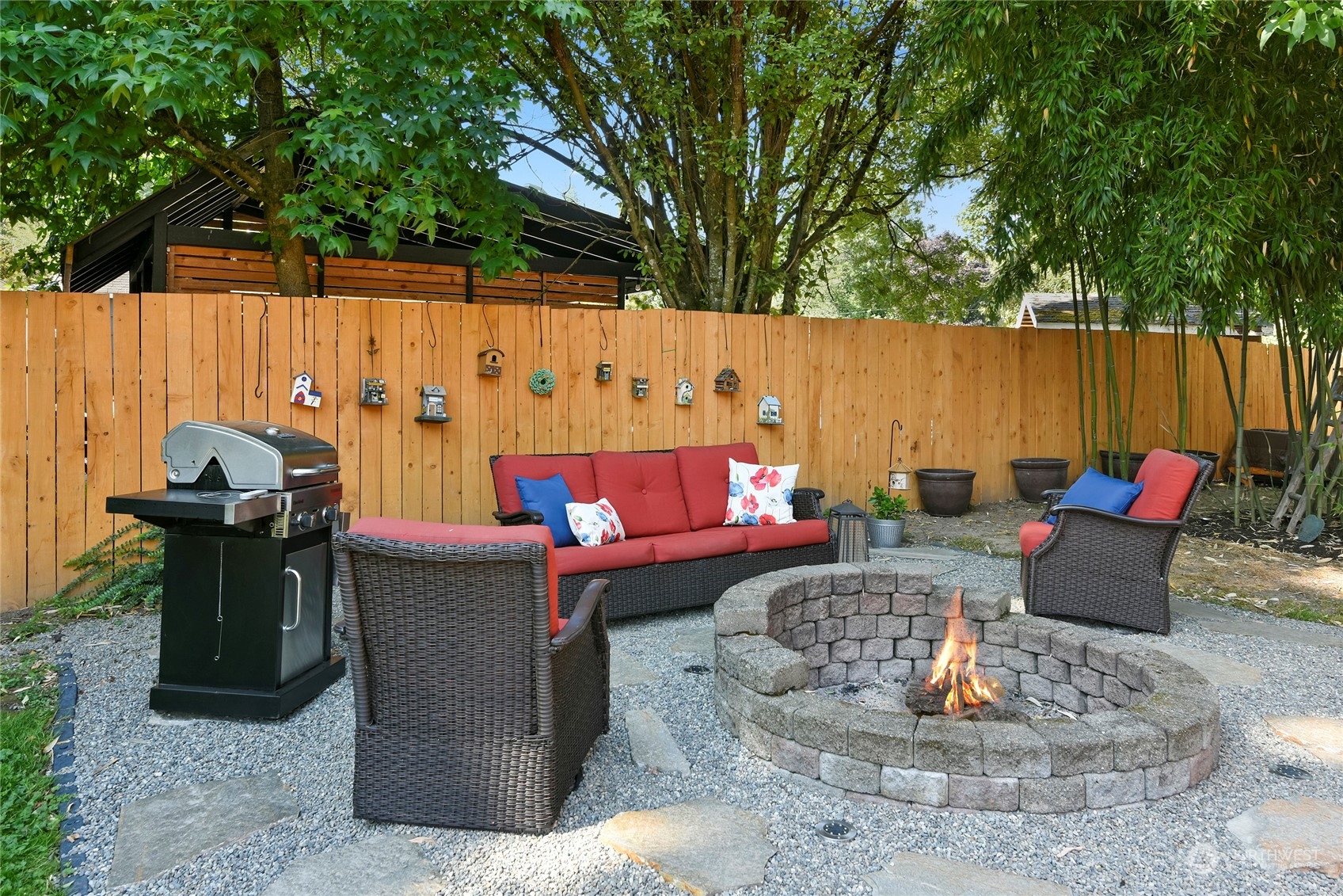 3609 Southeast 5th Place Renton, WA 98058 - Photo 32 of 40 a outdoor living space with furniture and a fireplace