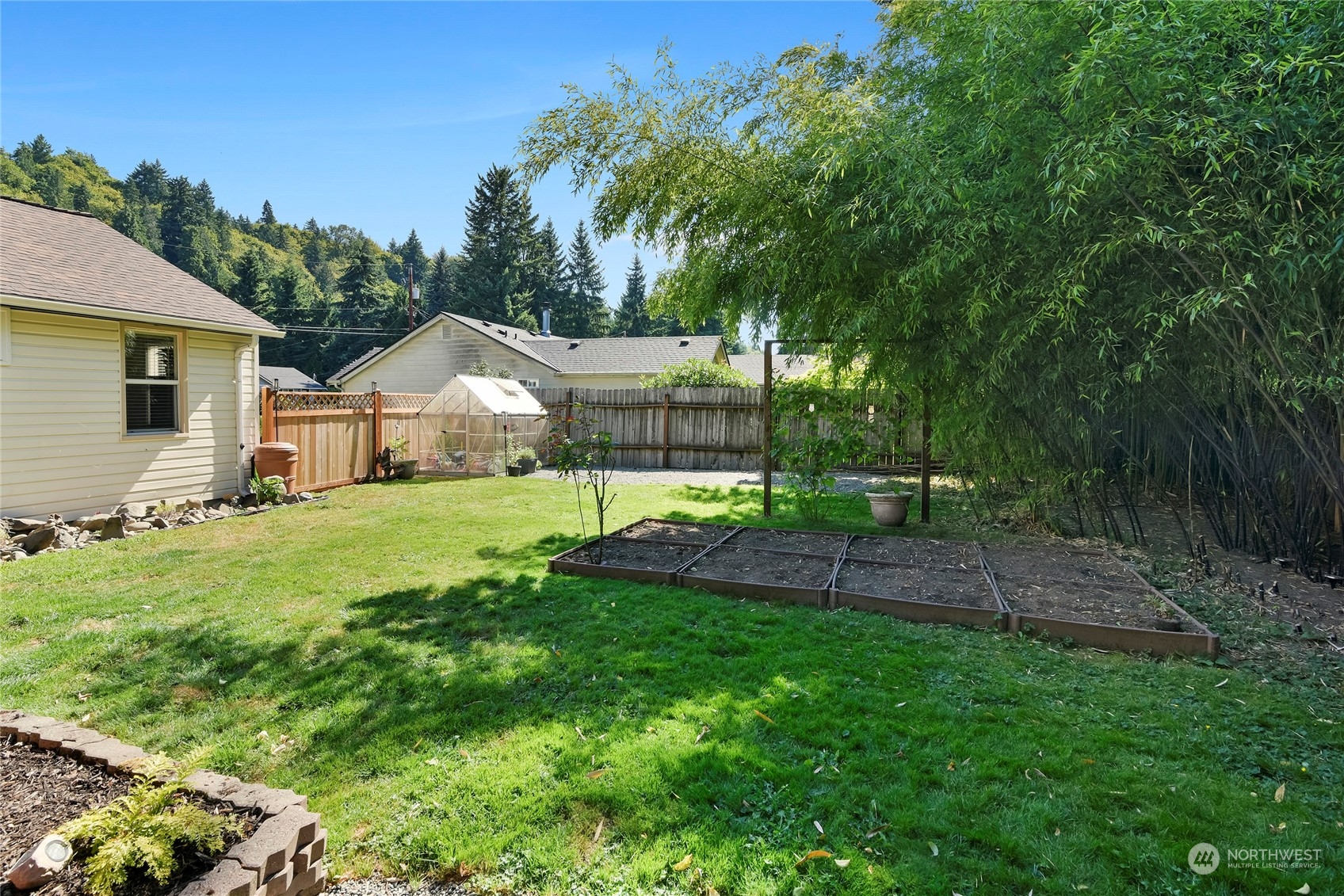 3609 Southeast 5th Place Renton, WA 98058 - Photo 33 of 40 a view of a house with a yard and sitting area