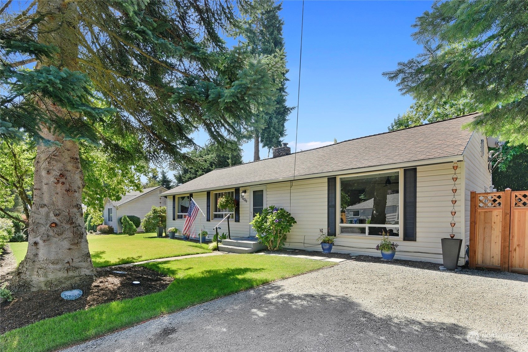 3609 Southeast 5th Place Renton, WA 98058 - Photo 5 of 40 a front view of a house with garden