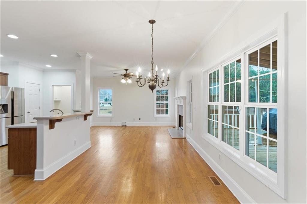 16 Quarter Horse Drive Northwest Rome, GA 30165 - Photo 11 of 51 a view of a room with wooden floor and a chandelier