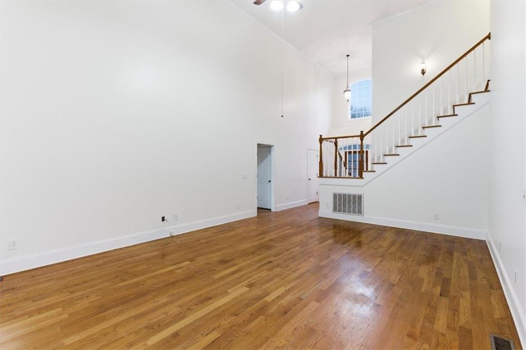 16 Quarter Horse Drive Northwest Rome, GA 30165 - Photo 13 of 51 a view of empty room with wooden floor and fan