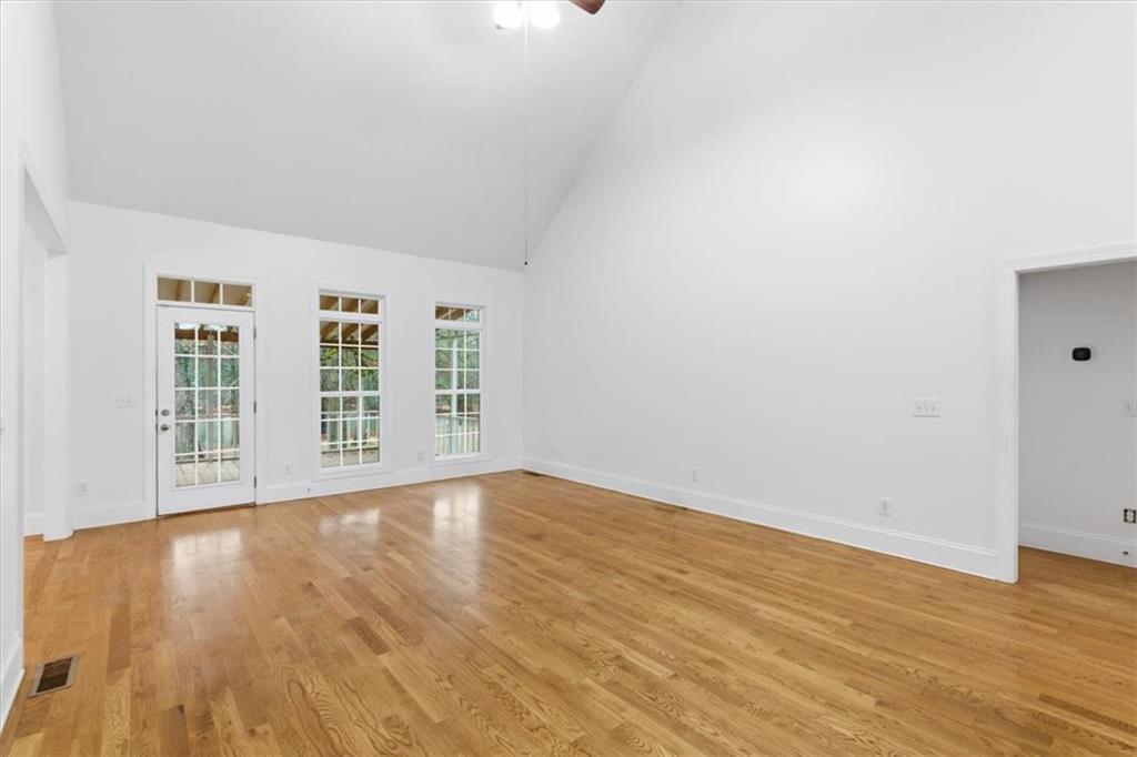 16 Quarter Horse Drive Northwest Rome, GA 30165 - Photo 14 of 51 wooden floor in an empty room with a window