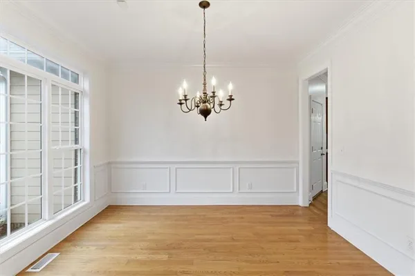 a view of an empty room with glass door