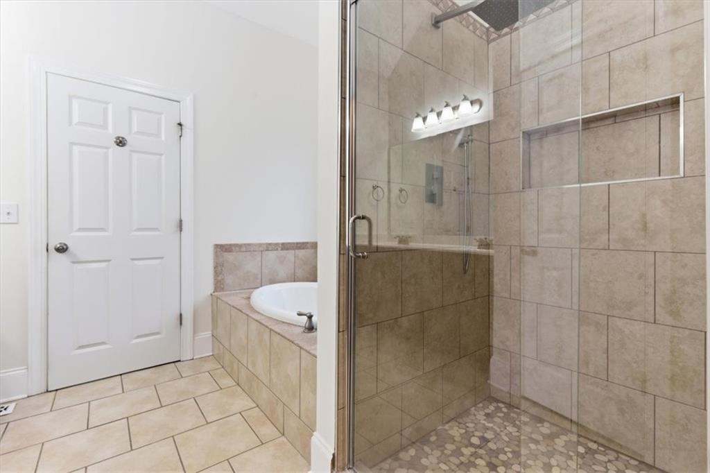 16 Quarter Horse Drive Northwest Rome, GA 30165 - Photo 21 of 51 a bathroom with a bathtub and a shower