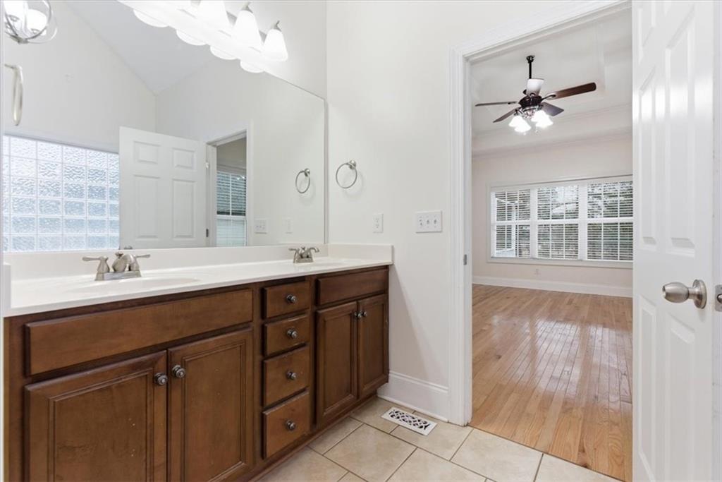 16 Quarter Horse Drive Northwest Rome, GA 30165 - Photo 25 of 51 a bathroom with a double vanity sink and a mirror