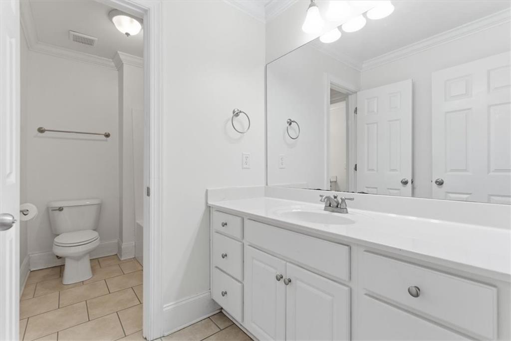 16 Quarter Horse Drive Northwest Rome, GA 30165 - Photo 27 of 51 a bathroom with a sink a toilet and a mirror