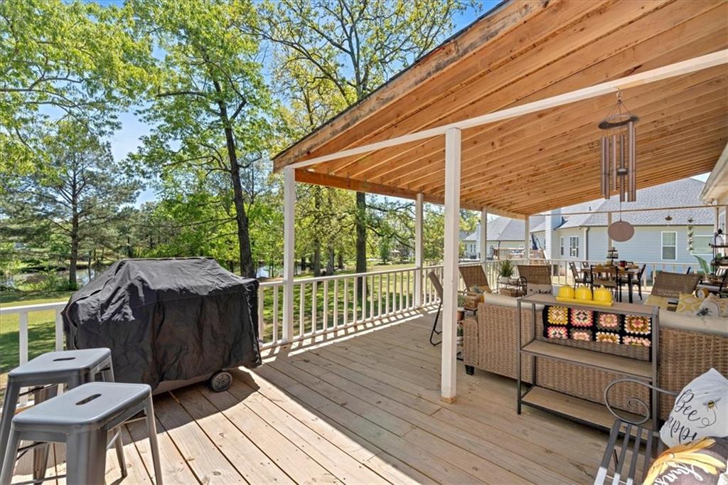 16 Quarter Horse Drive Northwest Rome, GA 30165 - Photo 37 of 51 a view of a roof deck with wooden floor and fence