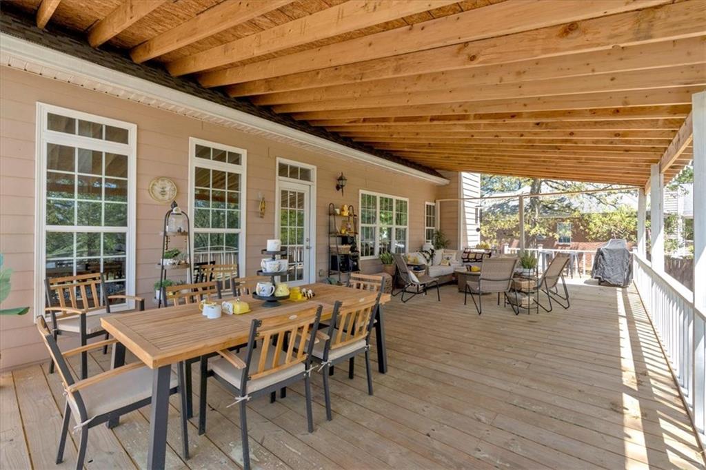 16 Quarter Horse Drive Northwest Rome, GA 30165 - Photo 38 of 51 a view of a patio with table and chairs and wooden floor