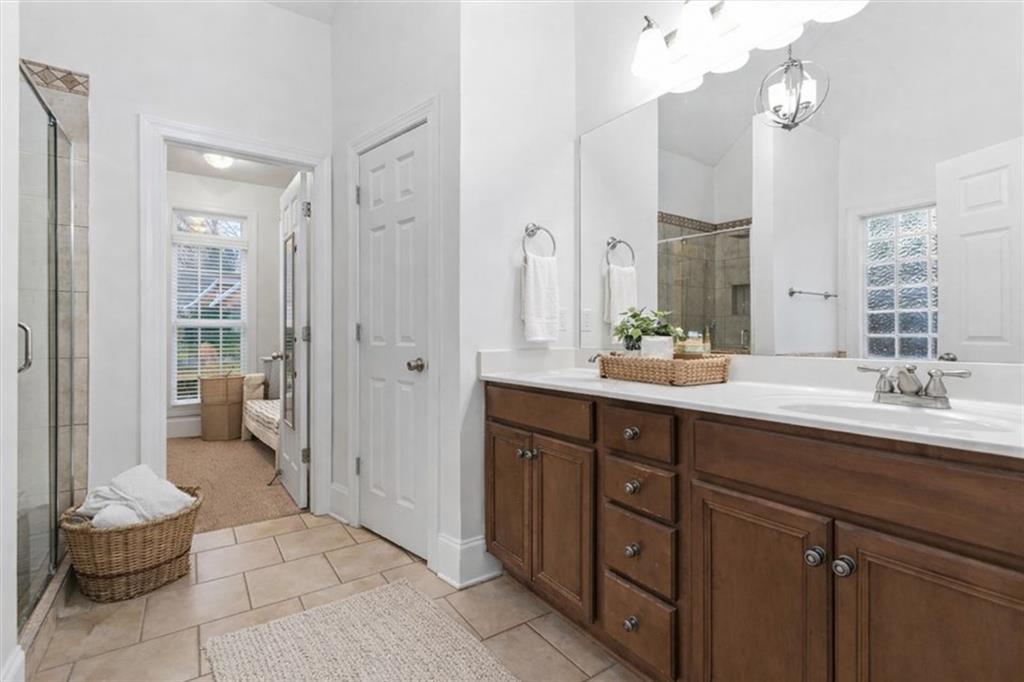 16 Quarter Horse Drive Northwest Rome, GA 30165 - Photo 49 of 51 a spacious bathroom with a double vanity sink a mirror and a toilet