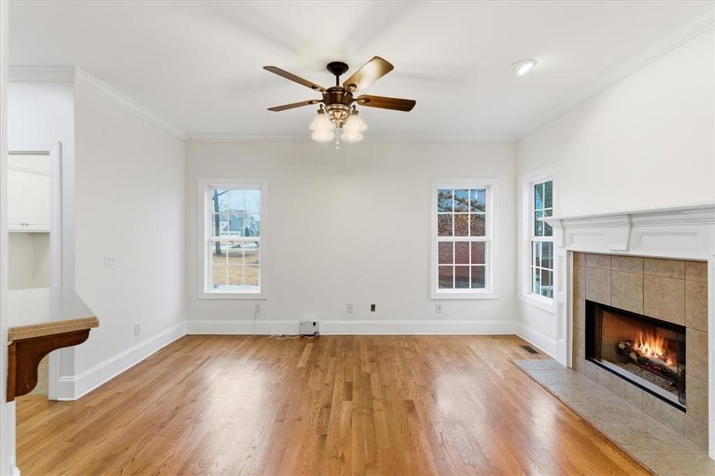 16 Quarter Horse Drive Northwest Rome, GA 30165 - Photo 9 of 51 a view of empty room with wooden floor and fireplace