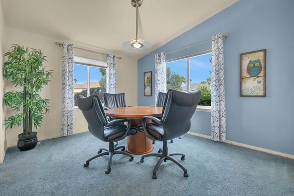 a view of a livingroom with furniture and a potted plant