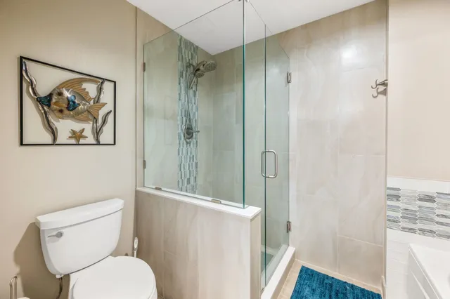 a bedroom with a bed and walk in closet