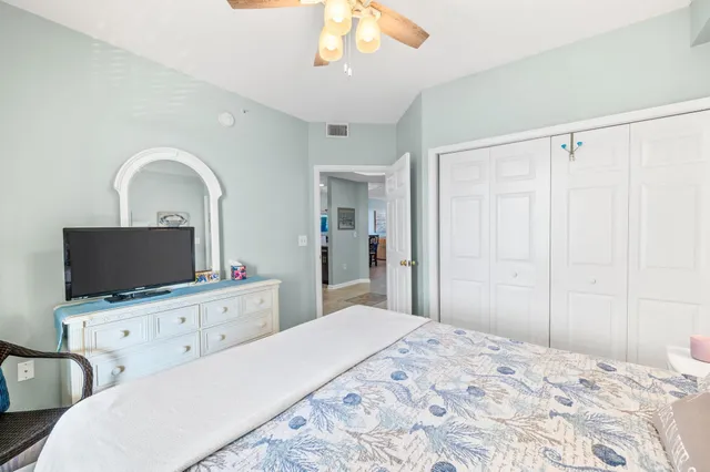 a view of swimming pool with outdoor seating and lake view