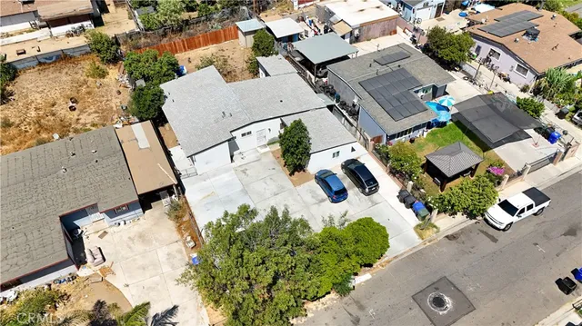 an aerial view of residential house with parking