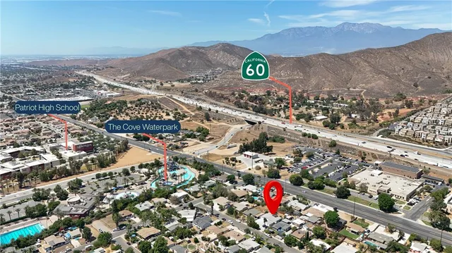 an aerial view of residential house and car parked