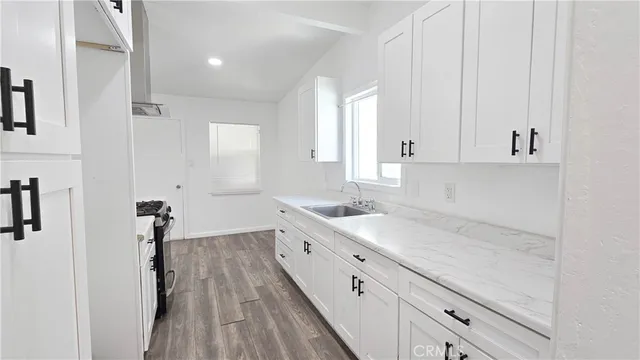 a view of a kitchen with sink and dishwasher