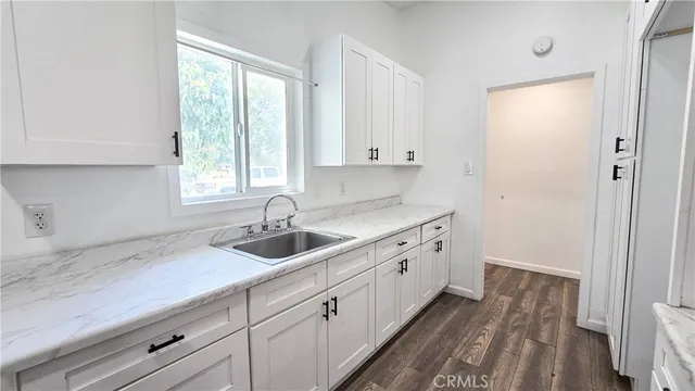 a kitchen with a sink and cabinets