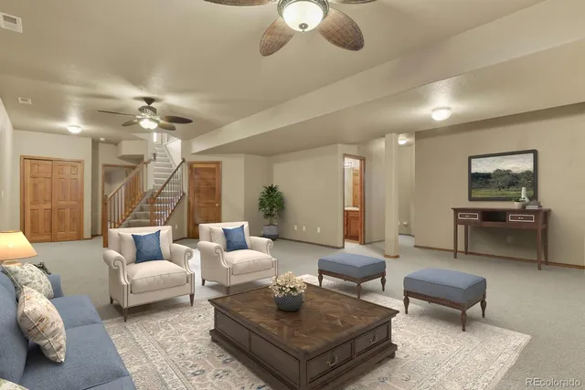 a view of a living room a kitchen and a fireplace