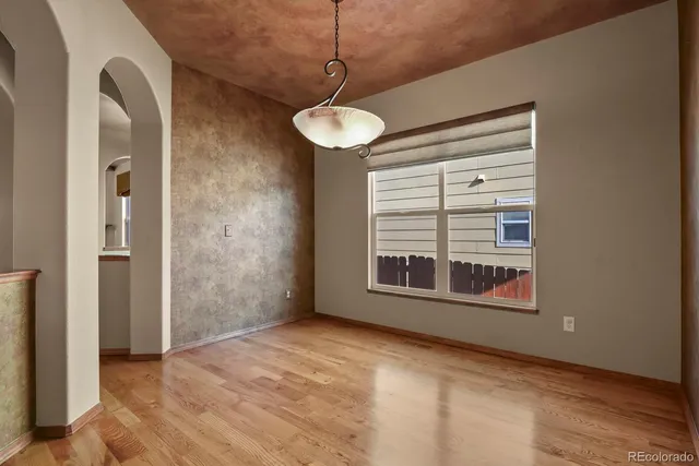 a kitchen with stainless steel appliances granite countertop a stove a sink dishwasher and a microwave oven with cabinets