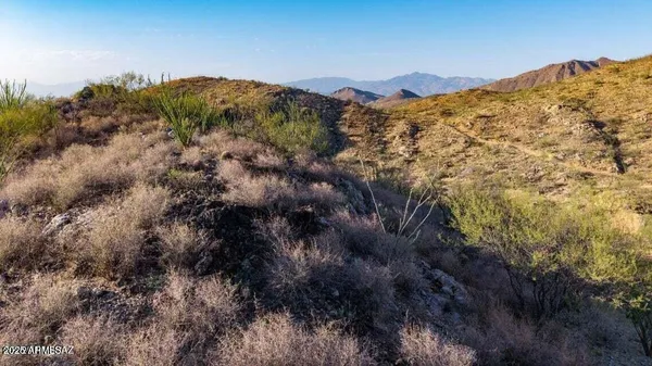 a view of mountains and valleys