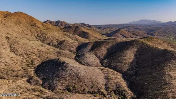 a view of mountains and valleys
