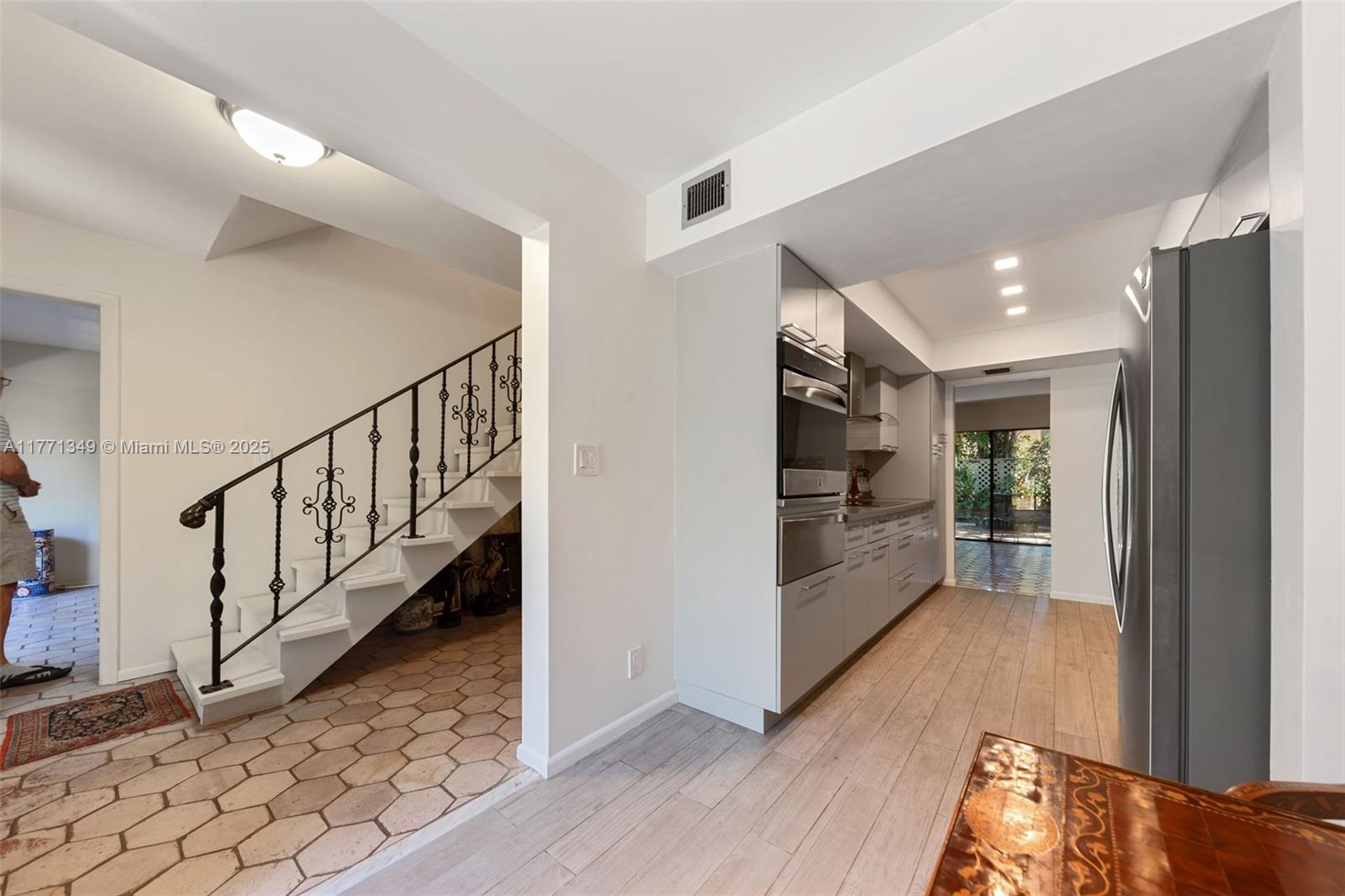 206 St Andrews Road, Unit 1878 Hollywood, FL 33021 - Photo 40 of 53 ENTRANCE VIEW OF HALL, STAIRWAY AND GLIMPSE OF 2ND BEDROOM